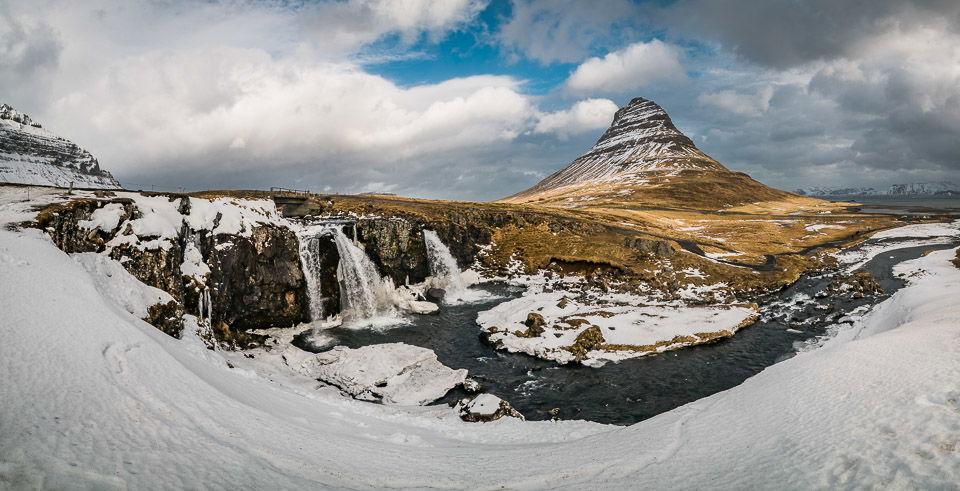 A wide landscape photograph showing the result of controlled camera settings